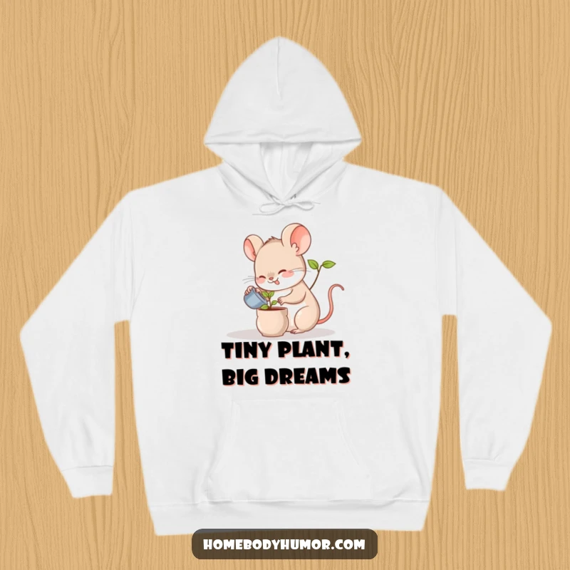 Funny hoodie depicting a happy mouse watering a small green plant, a cozy and cute gift for nature lovers.