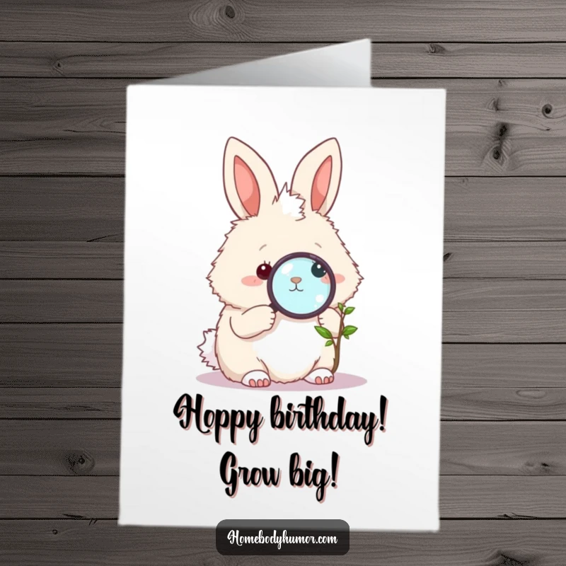 Funny Free Printable birthday card featuring a fluffy bunny holding a magnifying glass, intently studying a tiny, delicate plant.